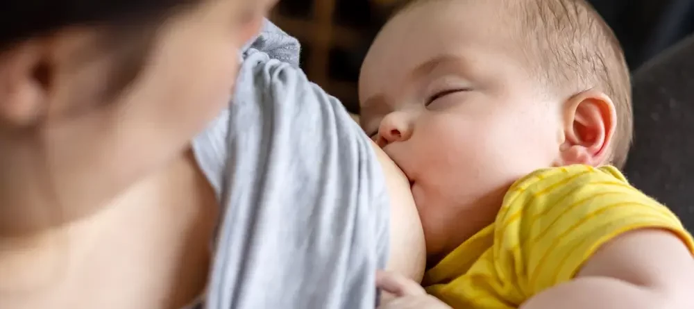 A mother breastfeeding her child