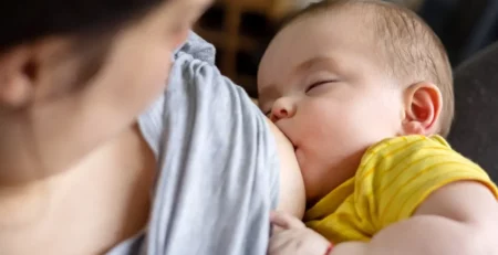 A mother breastfeeding her child